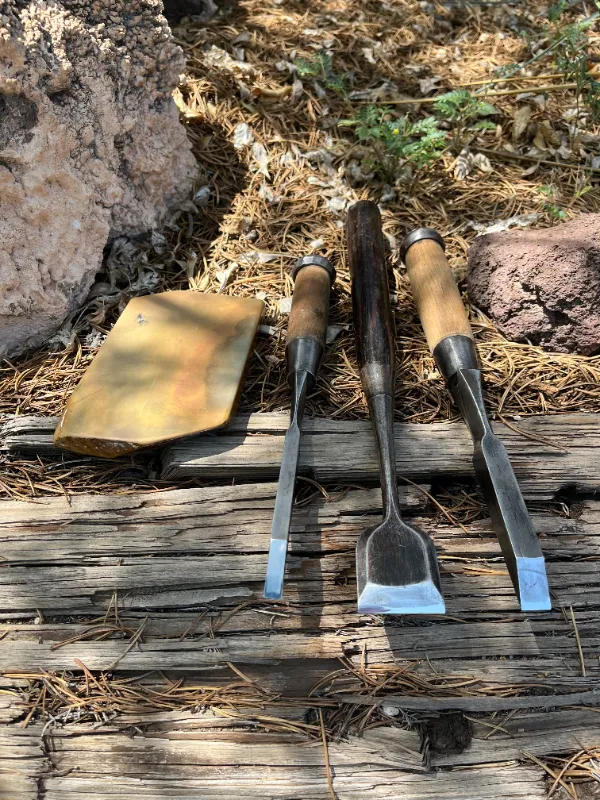 Three Japanese chisels and stone